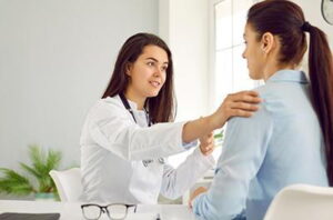 Gynaecologist counselling patient