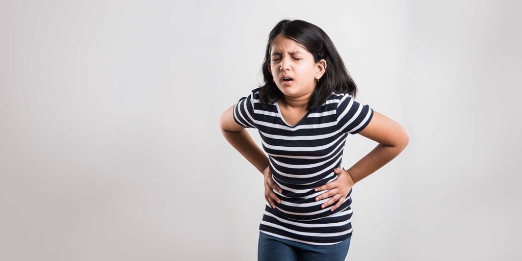 A adolescent girl is in pain during her periods